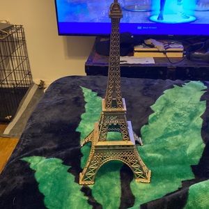 A silver Eiffel tower thrifted in good condition